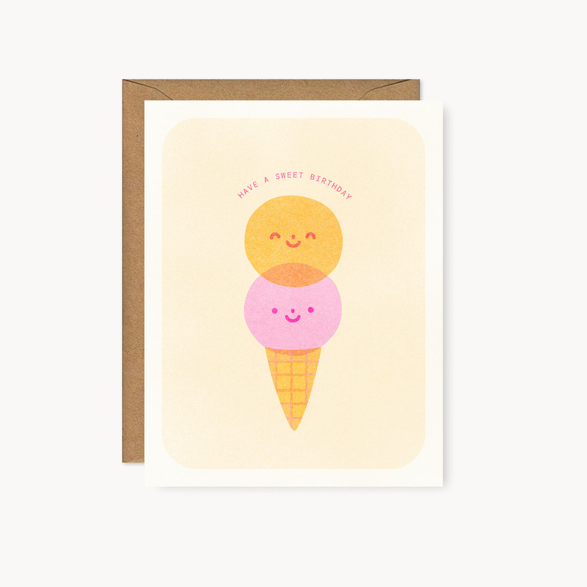 Whimsical risograph birthday card printed with fluorescent pink and yellow vegetable-based inks, featuring a cute smiling double-scoop ice cream cone. The words "Have a Sweet Birthday" arch above it, and a kraft envelope is included. A delightful handmade card from Seattle, WA by Minna May.