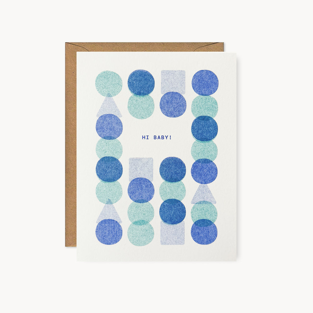 Whimsical risograph baby greeting card printed with sky blue and light teal vegetable-based inks, featuring a playful and modern pattern of overlapping blue, teal, and periwinkle circles, squares, and triangles. The words "Hi Baby!" sit in the center, and a kraft envelope is included. A delightful handmade new baby card from Seattle, WA by Minna May.
