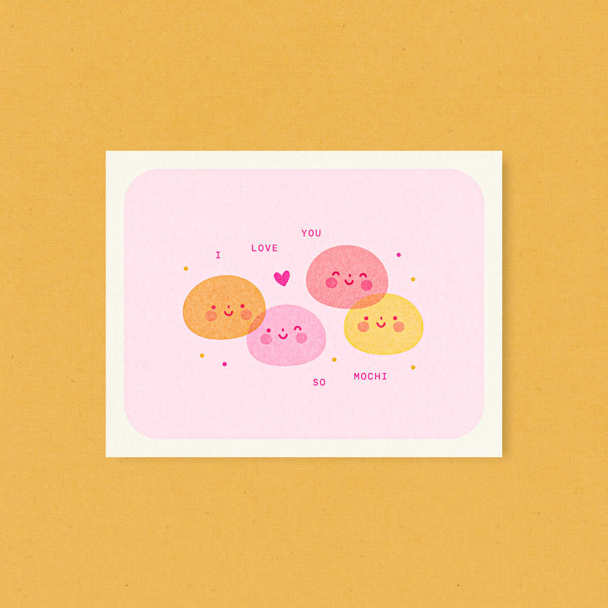 Whimsical Japanese dessert inspired risograph love card printed with fluorescent pink and yellow vegetable-based inks, featuring four cute smiling mochi in orange, pink, coral, and yellow with a little heart. The words "I Love You So Mochi" are scattered around them, and a kraft envelope is included. A delightful handmade card from Seattle, WA by Minna May.
