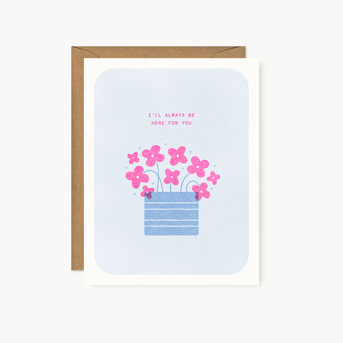 Whimsical risograph encouragement card printed with fluorescent pink and blue vegetable-based inks, featuring cute pink flowers with teal stems in a striped blue pot on a soft blue background. The words "I'll Always Be Here For You" appear above, and a kraft envelope is included. A delightful handmade card from Seattle, WA by Minna May.