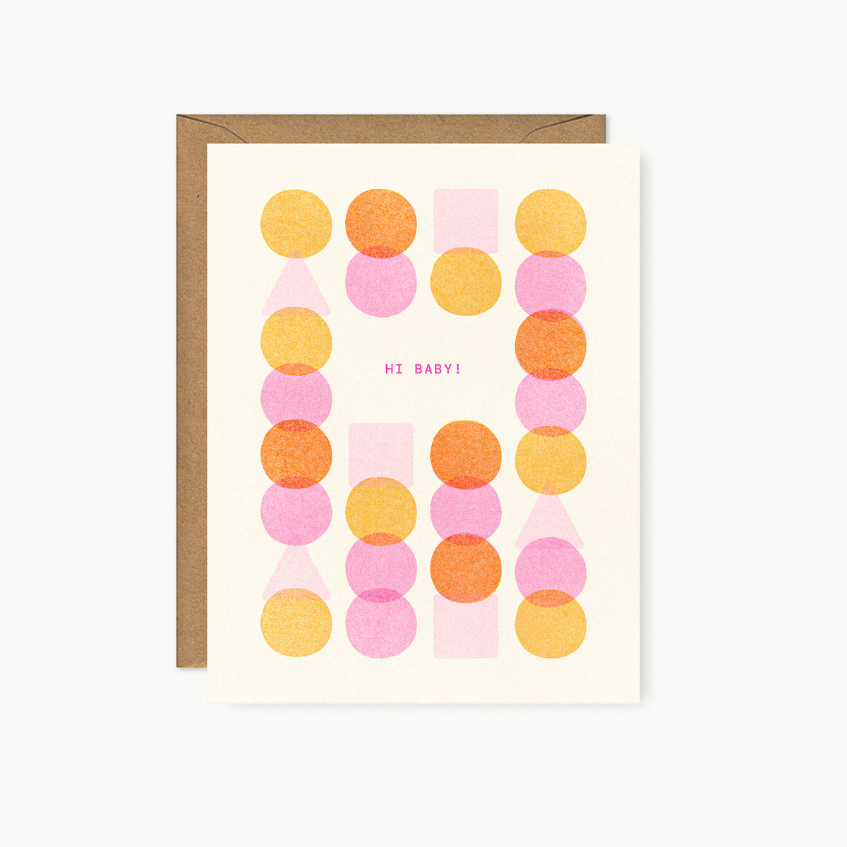 Whimsical risograph baby greeting card printed with fluorescent pink and yellow vegetable-based inks, featuring a playful and modern pattern of overlapping circles, squares, and triangles on cream paper. The words "Hi Baby!" sit in the center, and a kraft envelope is included. A delightful handmade new baby card from Seattle, WA by Minna May.